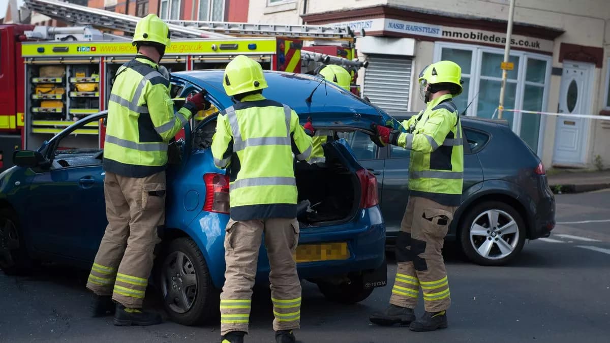 Rescue crew removing a vehicle roof during an extrication
